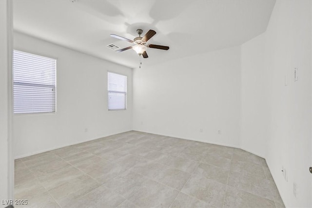 unfurnished room with ceiling fan