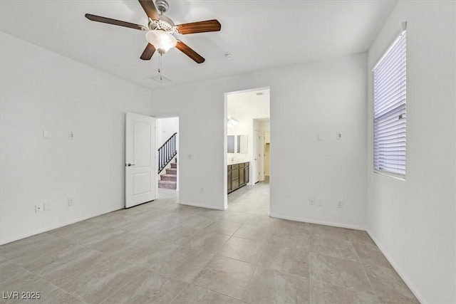 unfurnished room featuring ceiling fan