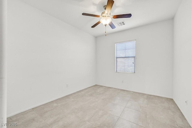 tiled empty room with ceiling fan