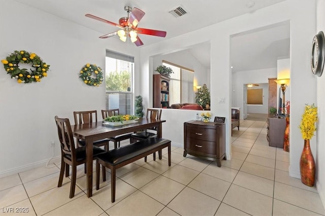 dining area with ceiling fan and light tile patterned floors