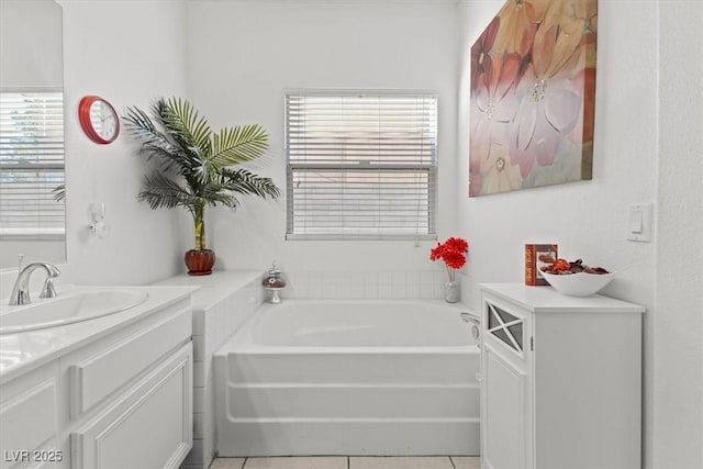 bathroom with vanity, tile patterned floors, plenty of natural light, and a tub