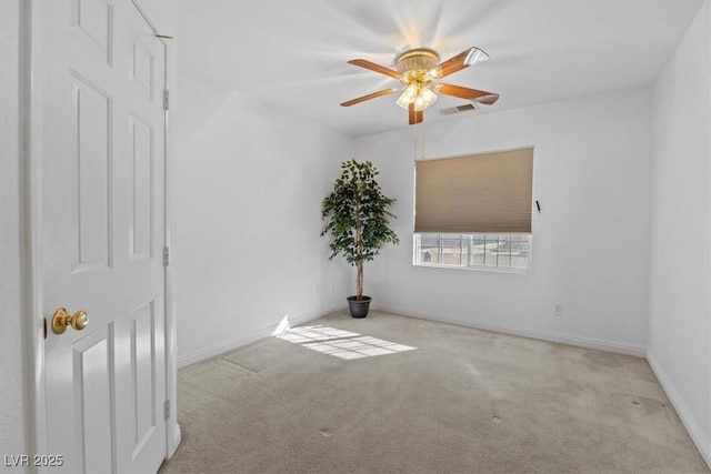 unfurnished room featuring ceiling fan and light colored carpet