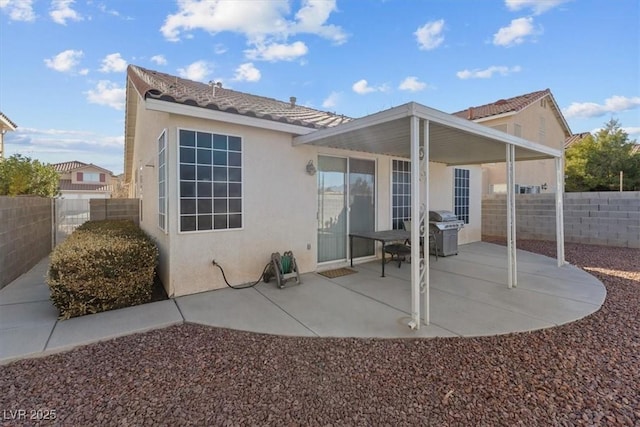 back of house with a patio area