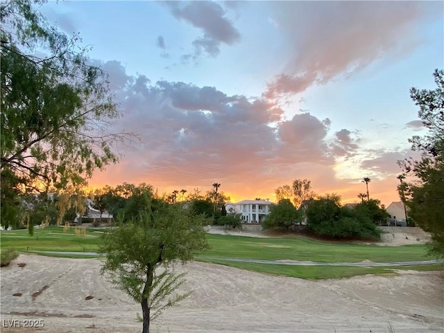 view of property's community with a lawn