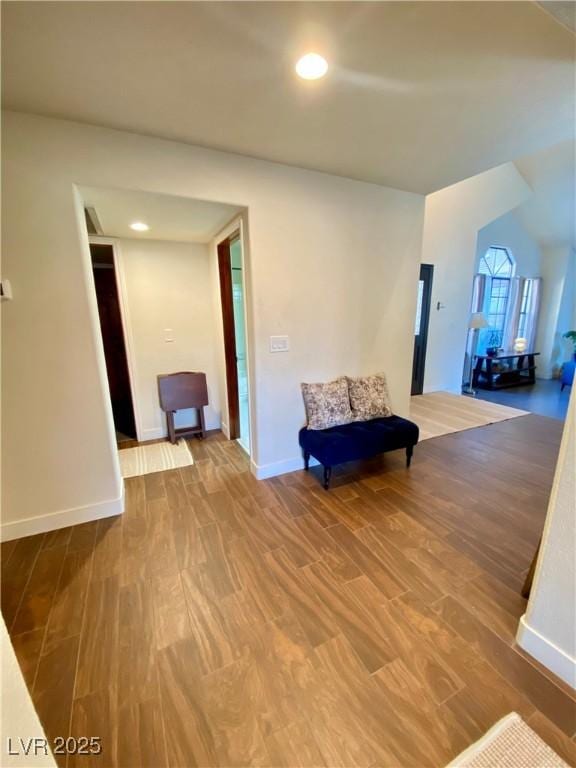 living area with hardwood / wood-style floors