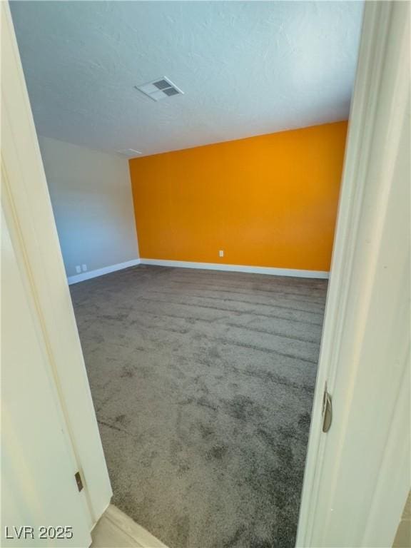 spare room featuring carpet floors