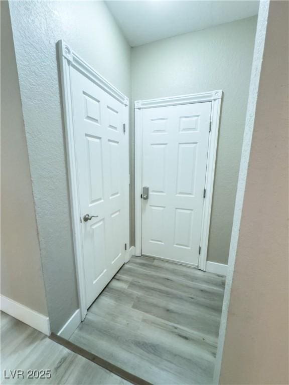 hallway featuring light wood-type flooring