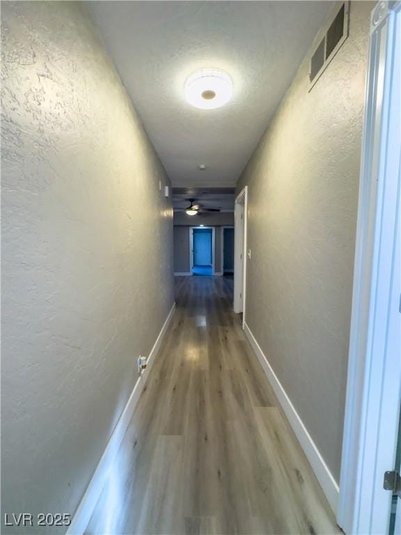 hallway featuring hardwood / wood-style floors