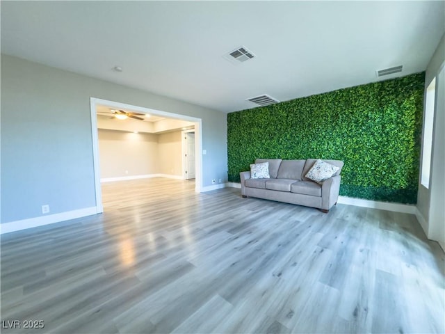 unfurnished living room featuring wood-type flooring