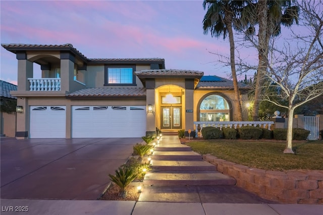 mediterranean / spanish-style house featuring a garage