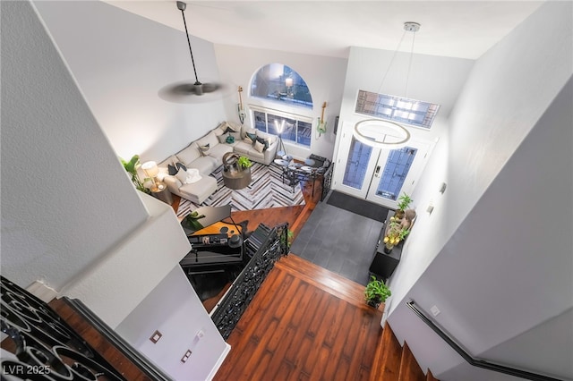 foyer entrance with a high ceiling and dark hardwood / wood-style flooring