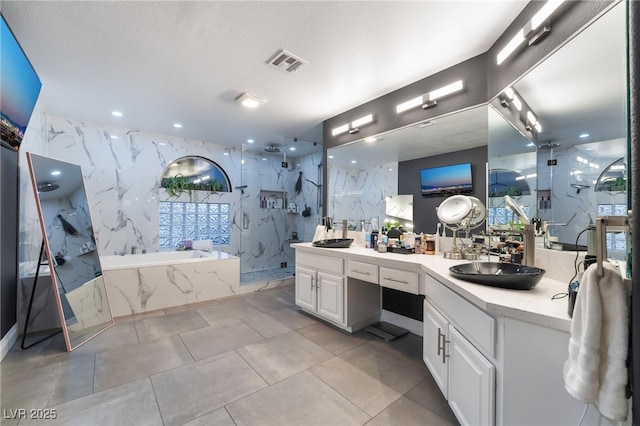 bathroom featuring vanity, tile patterned flooring, and plus walk in shower