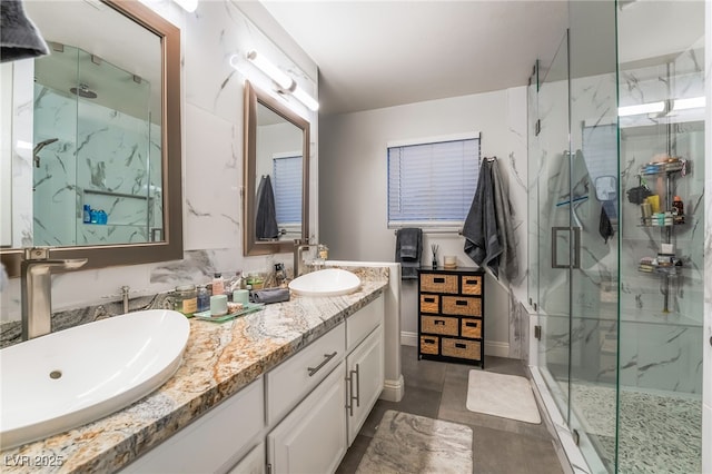 bathroom featuring vanity and a shower with door