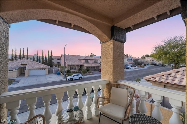 view of balcony at dusk