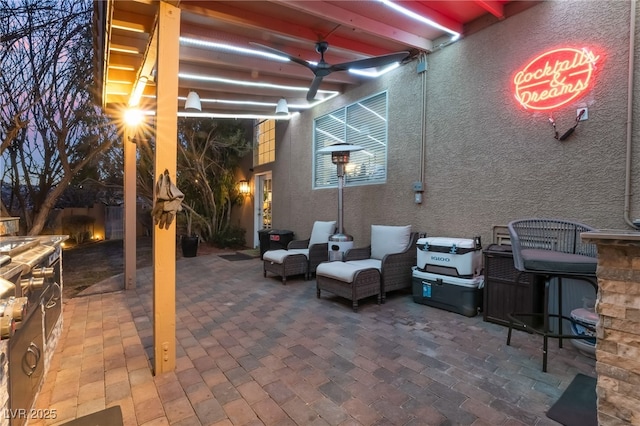 view of patio / terrace featuring ceiling fan