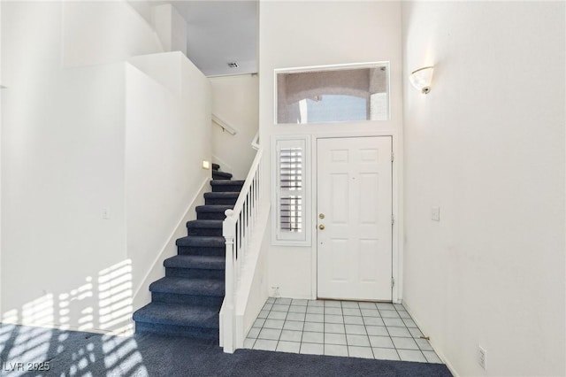 foyer entrance featuring light tile patterned floors