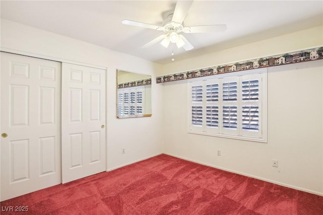 unfurnished bedroom with ceiling fan, a closet, and carpet floors