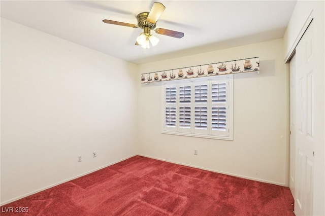 empty room with ceiling fan and carpet floors