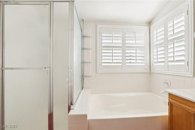 bathroom with a bathtub and vanity