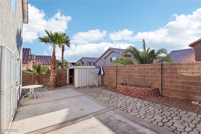 view of patio with a storage shed