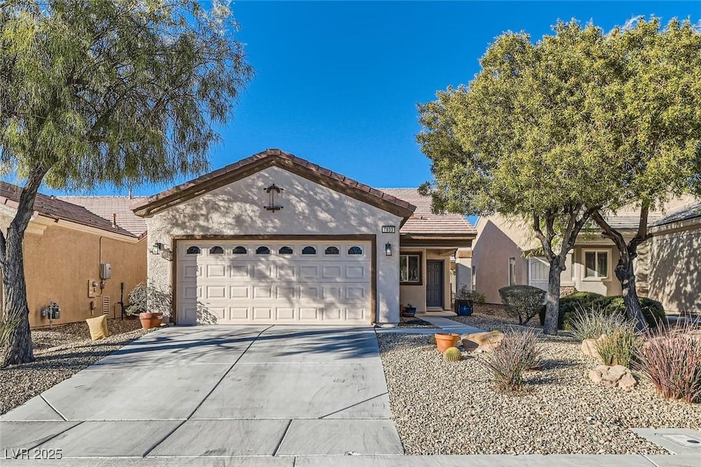 ranch-style house featuring a garage