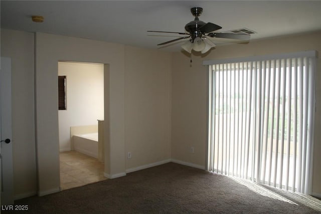 carpeted empty room with ceiling fan