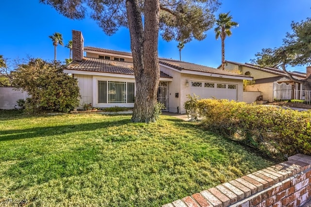 view of front facade with a front lawn and a garage