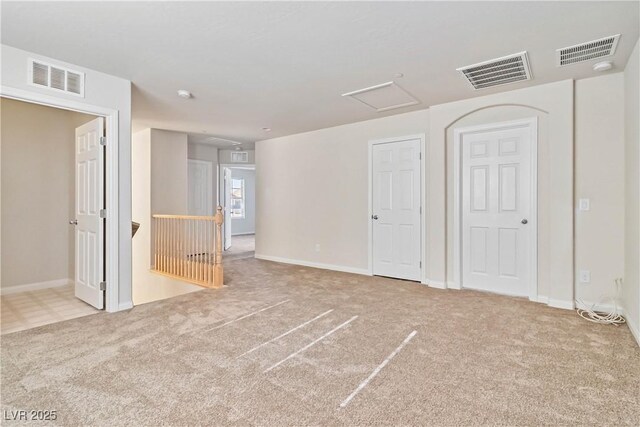 unfurnished bedroom with light colored carpet