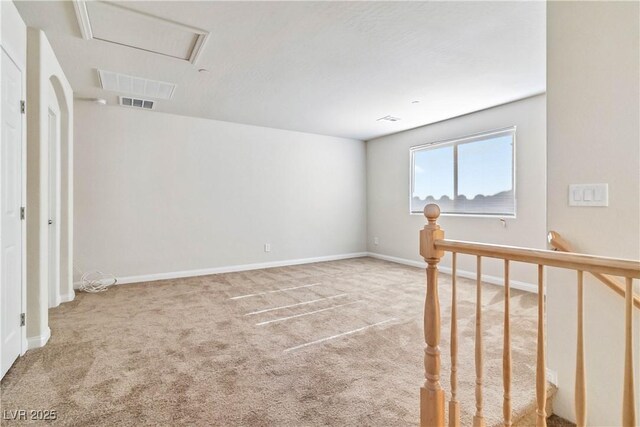 unfurnished room featuring carpet