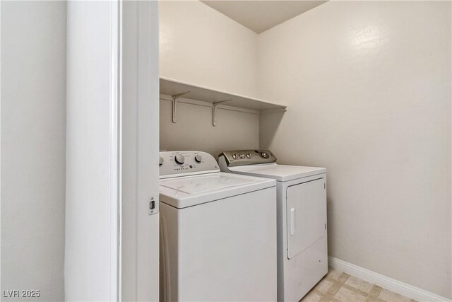 laundry area with washing machine and dryer