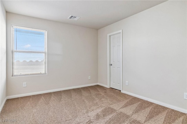 unfurnished room with carpet flooring