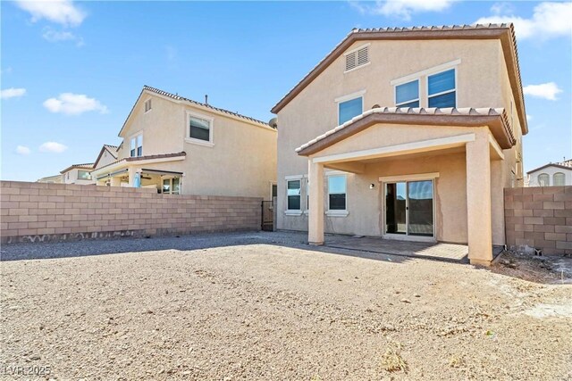 back of property with a patio area