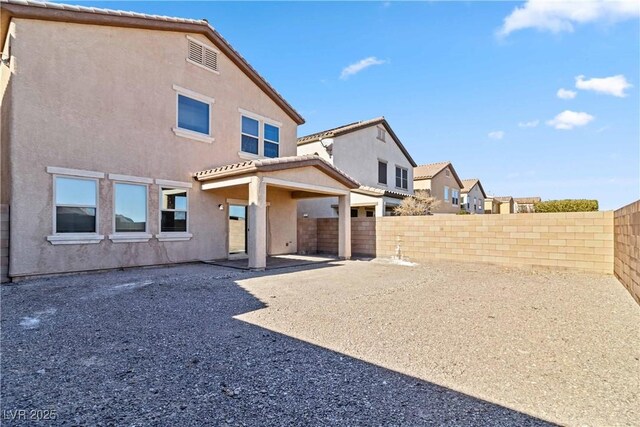 rear view of property featuring a patio