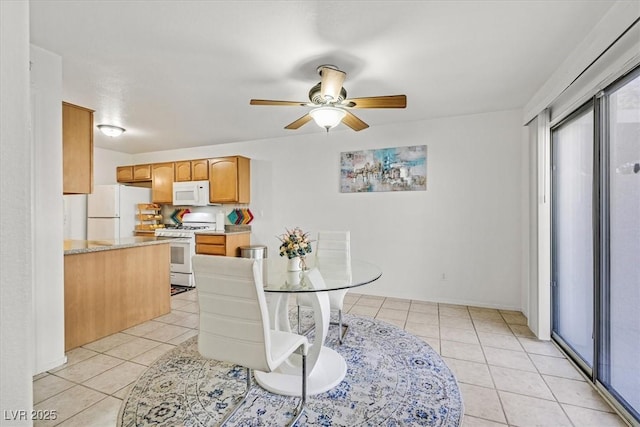 dining space featuring ceiling fan and light tile patterned floors