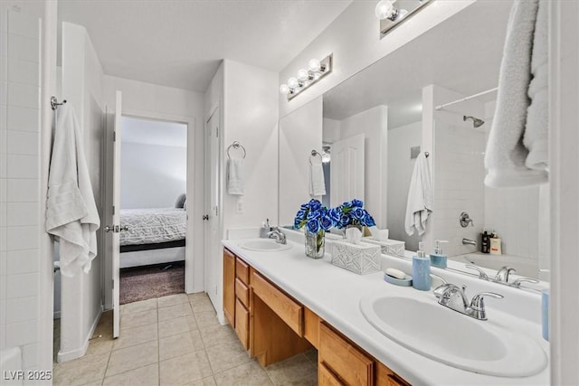 bathroom featuring vanity, tile patterned flooring, and a bathing tub