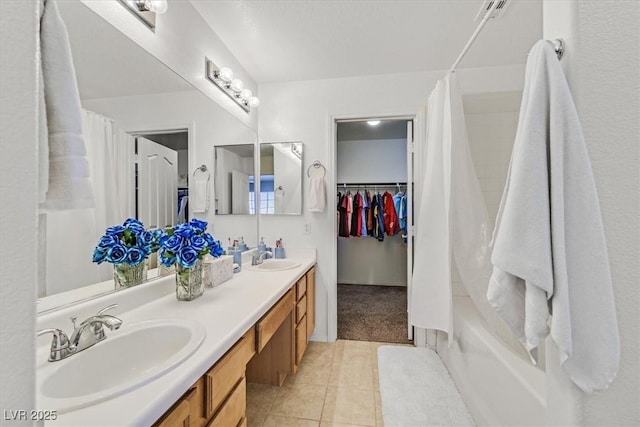 bathroom featuring shower / bath combo with shower curtain, vanity, and tile patterned flooring