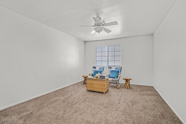 living area with ceiling fan and carpet flooring