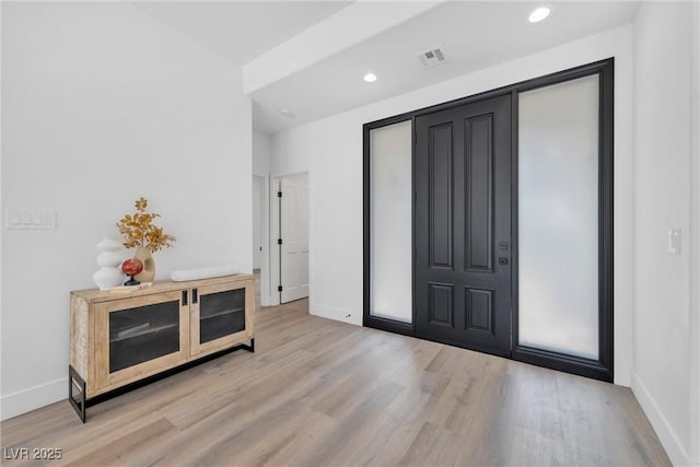 foyer entrance featuring light wood-type flooring