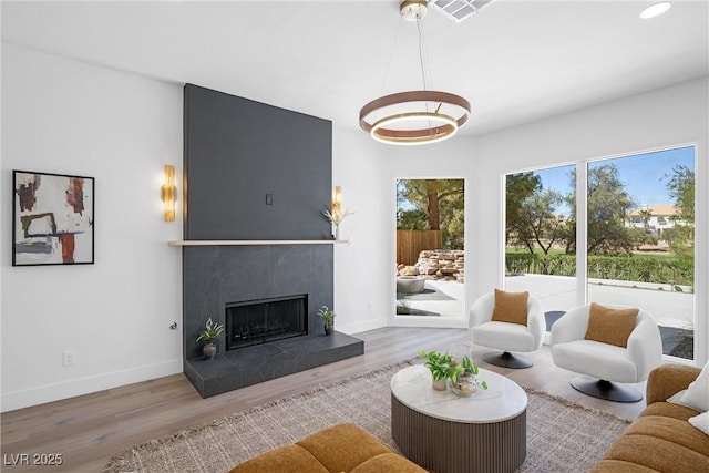 living room featuring a fireplace and hardwood / wood-style flooring