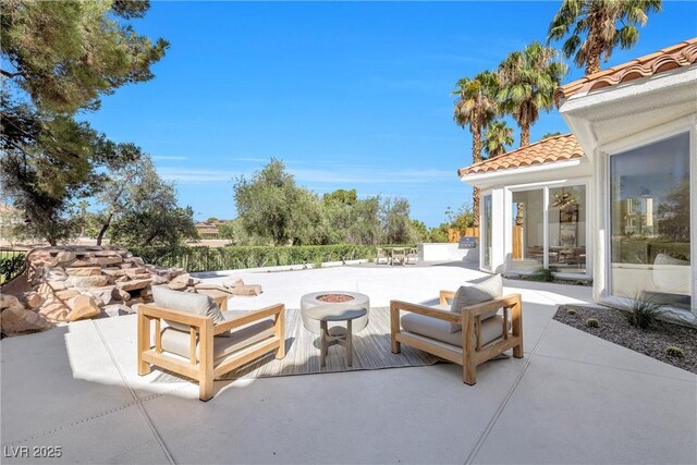 view of patio featuring an outdoor fire pit