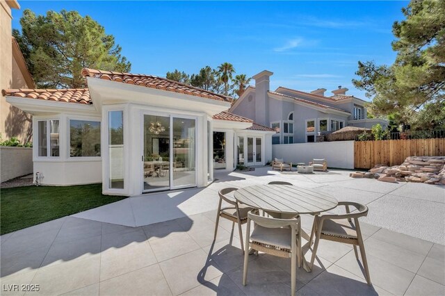 back of house featuring french doors and a patio