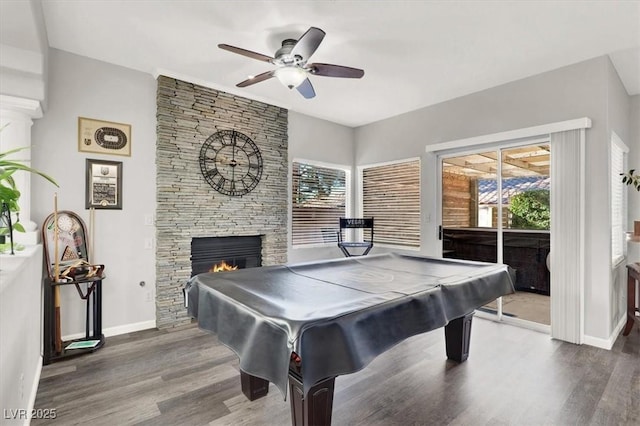 recreation room with a fireplace, ceiling fan, pool table, and hardwood / wood-style flooring