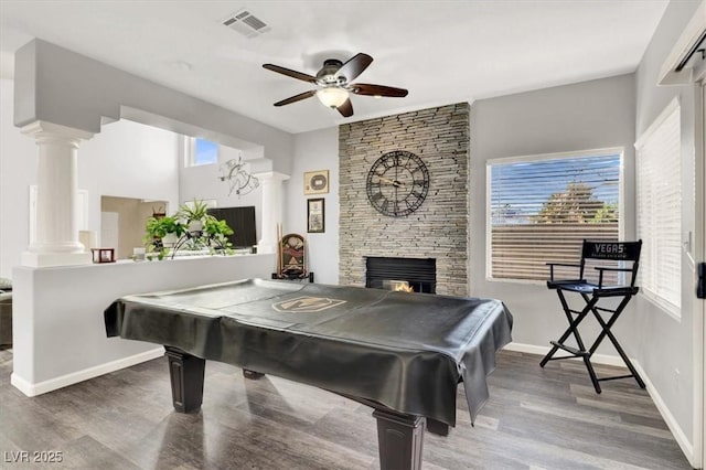 game room featuring ceiling fan, hardwood / wood-style flooring, pool table, and a fireplace