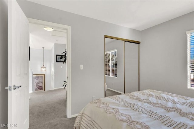 carpeted bedroom featuring a closet