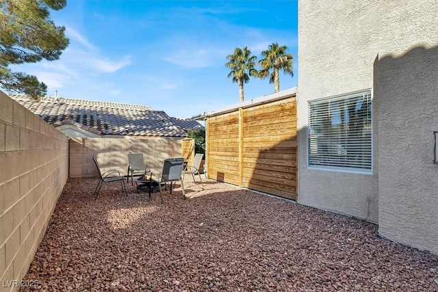 view of yard with a patio area and a fire pit