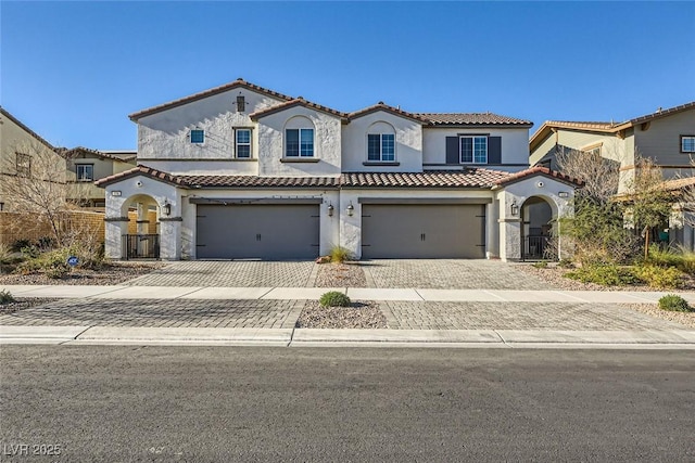 mediterranean / spanish-style home featuring a garage