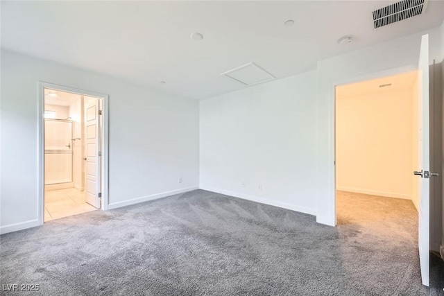 unfurnished room with light colored carpet