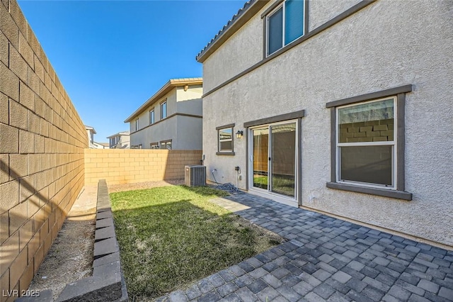 view of yard featuring a patio area and cooling unit