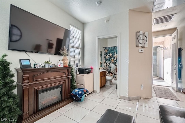 living room with light tile patterned flooring