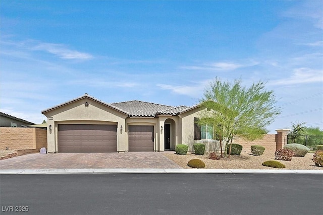 view of front of property with a garage